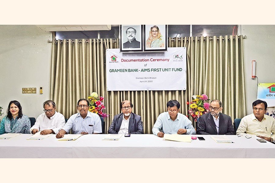 Prof. Dr. AKM Saiful Majid, Chairman of Grameen Bank; Md. Abdur Rahim Khan, MD of Grameen Bank and Yawer Sayeed, MD & CEO of AIMS of Bangladesh Limited, seen in the Documentation Ceremony of "Grameen Bank-AIMS First Unit Fund" held on Sunday.