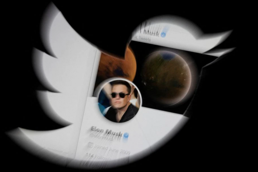 Elon Musk's twitter account is seen through the Twitter logo in this illustration taken, April 25, 2022 –Reuters/Dado Ruvic/Illustration