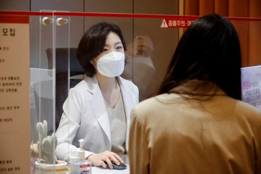 Kim Ji-hyun, a professor at Cha Fertility Center, checks a patient at the clinic, in Bundang, South Korea, April 30, 2022. Reuters