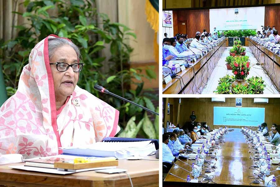 Prime Minister Sheikh Hasina presiding over the NEC meeting joining virtually from Ganabhaban and other members of the council participating from NEC conference room in the city's Sher-e-Bangla Nagar area and also from the Cabinet Division conference room at secretariat on Tuesday –PID Photos