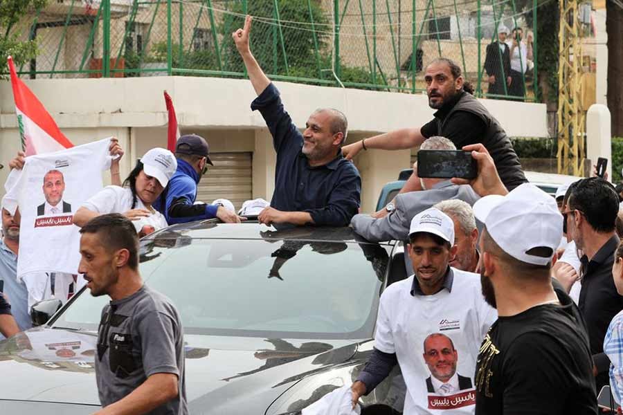 Opposition candidate in Lebanon's parliamentary election, Yassin Yassin, gesturing as he is greeted by his supporters as Lebanese await the official election results in Jeb Jennin of West Bekaa in Lebanon on Monday –Reuters photo