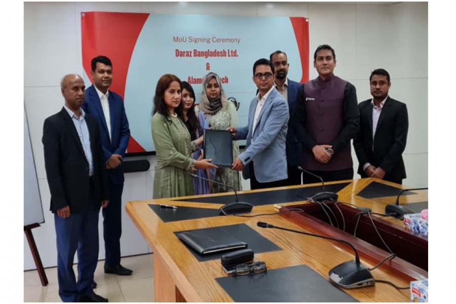 Mrs Sultana Jahan, director of Alamgir Ranch and also vice-chairman of Labib Group, and Mr AHM Hasinul Quddus, chief corporate affairs officer of Daraz Bangladesh Ltd, exchanging documents after signing an MoU in the capital on Tuesday