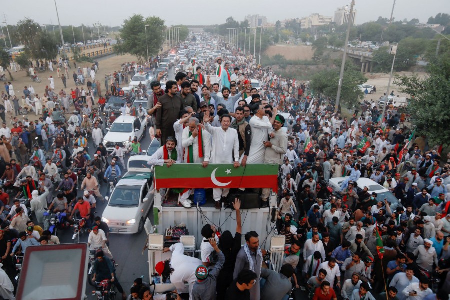 Ousted Pakistani Prime Minister Imran Khan gestures as he travels on a vehicle to lead a protest march in Islamabad, Pakistan on May 26, 2022 — Reuters photo