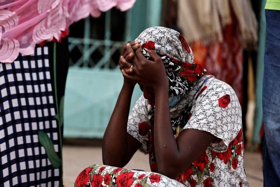 Kaba, a mother of a ten-day-old baby, reacts as she sits outside the hospital, where newborn babies died in a fire at the neonatal section of a regional hospital in Tivaouane, Senegal, May 26, 2022. REUTERS/Zohra Bensemra