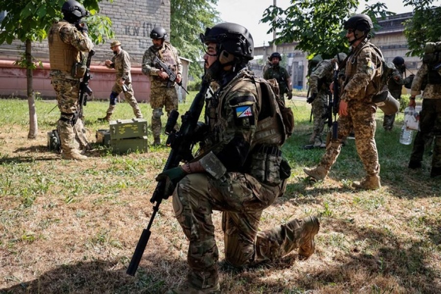 Members of foreign volunteers unit which fights in the Ukrainian army take positions, as Russia's attack on Ukraine continues, in Sievierodonetsk, Luhansk region Ukraine June 2, 2022 — Reuters