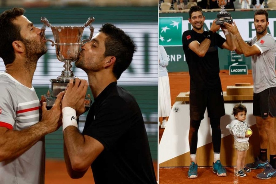 Tennis - French Open - Roland Garros, Paris, France - June 4, 2022 El Salvador's Marcelo Arevalo and Netherlands' Jean-Julien Rojer celebrate with the trophy after winning their men's doubles final match against Croatia's Ivan Dodig and Austin Krajicek of the US (left).Netherlands' Jean-Julien Rojer is pictured with his child and teammate Arevalo (right) Reuters