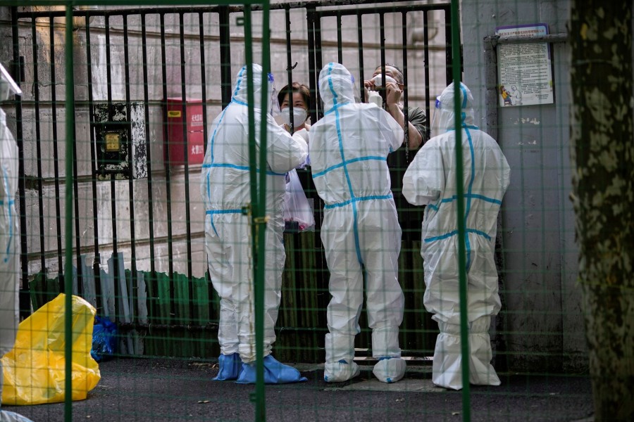 A resident gets tested for the coronavirus disease (COVID-19) behind barriers of a sealed area, after the lockdown placed to curb the COVID-19 outbreak was lifted in Shanghai, China on June 8, 2022 — Reuters photo