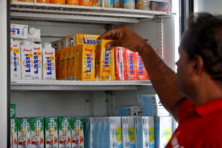 A worker arranges Amul drinks at an Amul cafe in Ahmedabad, India, June 8, 2022. Picture taken June 8, 2022. REUTERS/Amit Dave