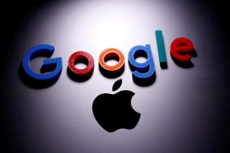 A 3D printed Google logo is placed on the Apple Macbook in this illustration taken Apr 12, 2020. REUTERS