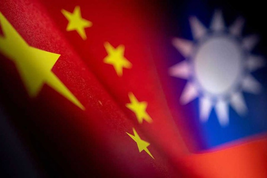 Chinese and Taiwanese printed flags are seen in this illustration taken, April 28, 2022. REUTERS/Dado Ruvic/Illustration