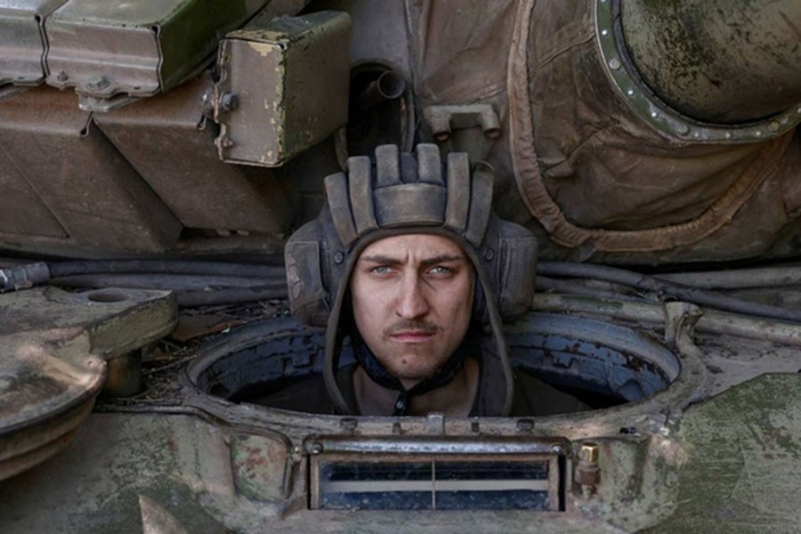 A Ukrainian serviceman looks on from inside a tank at a position in Donetsk region, as Russia's attack on Ukraine continues, Ukraine June 11, 2022. REUTERS/Stringer