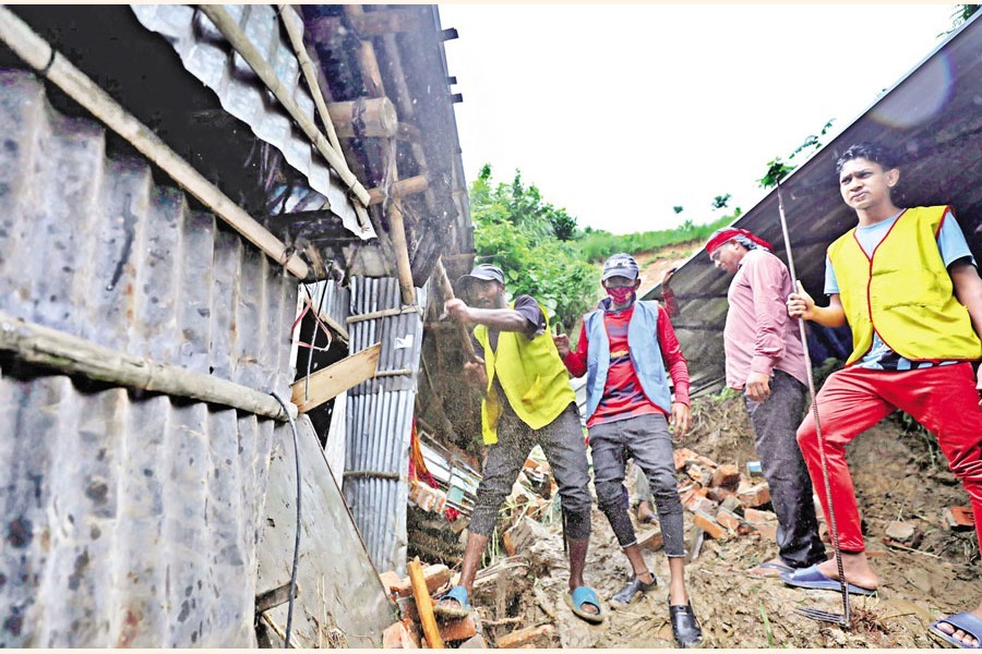 Chattogram district administration dismantling risky houses built on the hills of the port city as part of its eviction drive amid incessant rain that often leads to landslides, killing people. The photo was taken from the city’s East Firozshah area on Sunday — Focus Bangla