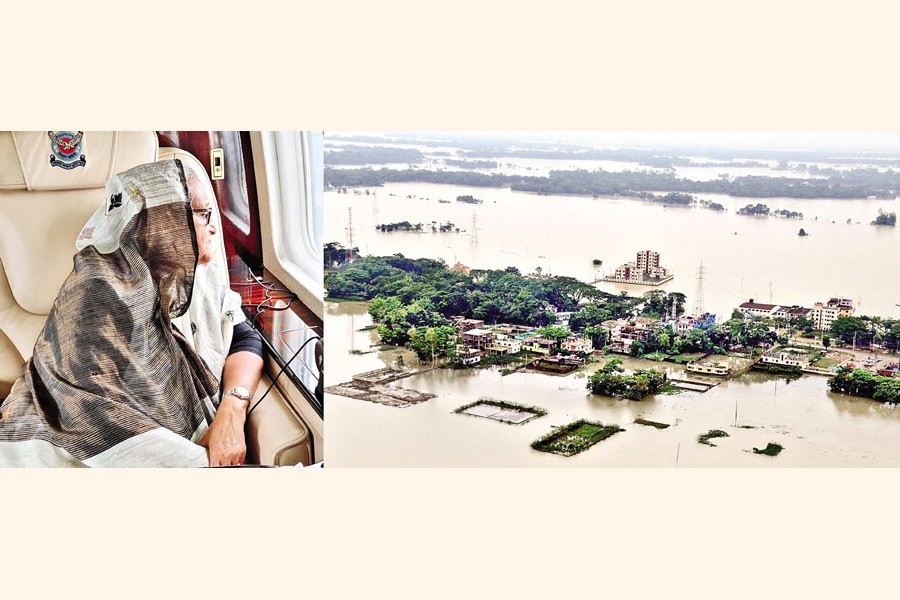 Prime Minister Sheikh Hasina inspecting the flood situation in Sylhet, Sunamganj, Netrokona and adjacent areas from a helicopter on Tuesday — PID