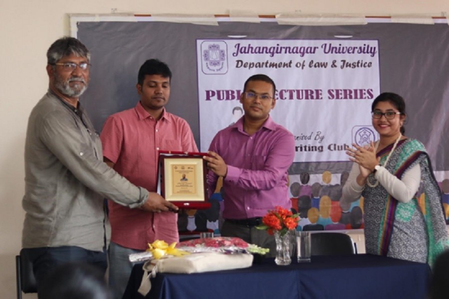 Sharif Jamil is receiving Honorific Crest. From left(Sharif Jamil, General Secretary, BAPA, Suprobhat Pal, Associate Professor, Dean of the Faculty of Law Tapos Kumar Das and Assistant Professor Preeti Kana Sikder)