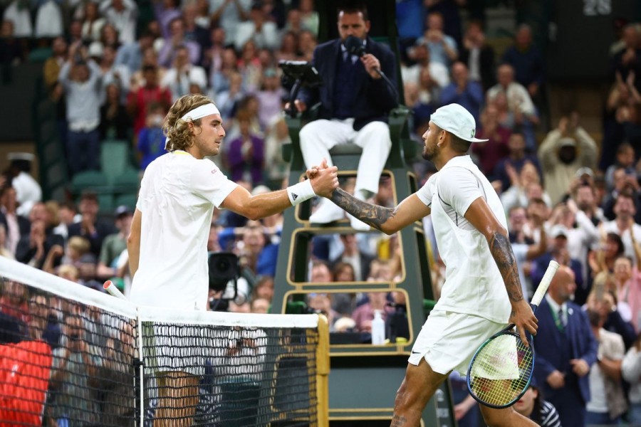 Tennis - Wimbledon - All England Lawn Tennis and Croquet Club, London, Britain - July 2, 2022 Australia's Nick Kyrgios with Greece's Stefanos Tsitsipas after winning their third round match REUTERS/Hannah Mckay