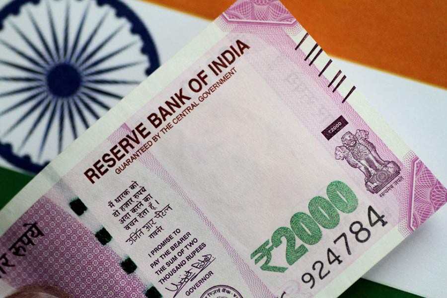 Indian rupee tumbles to record low against dollar