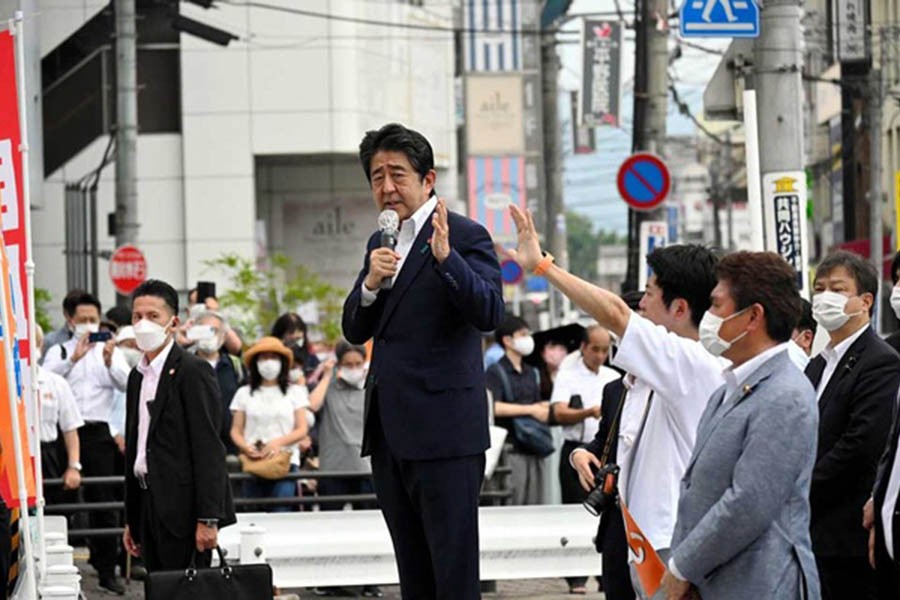 Former Japanese Prime Minister Shinzo Abe makes a speech before he was shot from behind by a man in Nara, western Japan Jul 8, 2022, in this photo taken by The Asahi Shimbun. The Asahi Shimbun/REUTERS