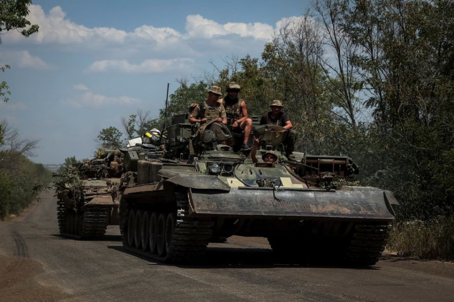 Ukrainian servicemen ride on a military vehicle, amid Russia's attack on Ukraine, in Donetsk region, Ukraine July 8, 2022. REUTERS/Gleb Garanich