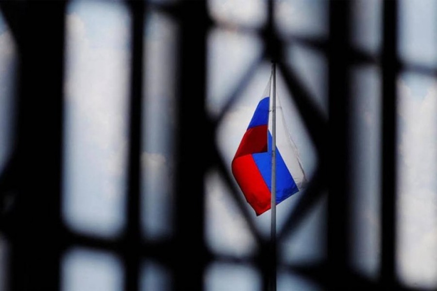 The Russian flag flies over the Embassy of Russia in Washington, US, August 6, 2018. REUTERS