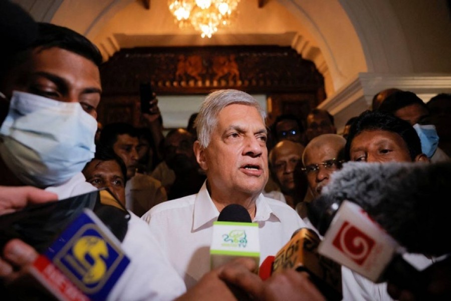 Ranil Wickremesinghe who has been elected as the Eighth Executive President under the Constitution speaks to media as he leaves a Buddhist temple, amid the country's economic crisis, in Colombo, Sri Lanka July 20, 2022. REUTERS/ Dinuka Liyanawatte