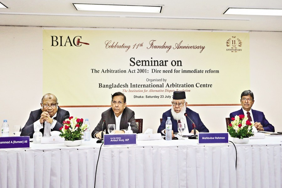 Law Minister Anisul Huq (second from left) attends as the chief guest a seminar on 'The Arbitration Act 2001: Dire need for immediate reform', organised by the Bangladesh International Arbitration Centre (BIAC) at a city hotel on Saturday. BIAC Chairman and President of the International Chamber of Commerce-Bangladesh Mahbubur Rahman (second from right) chaired the function. — FE photo