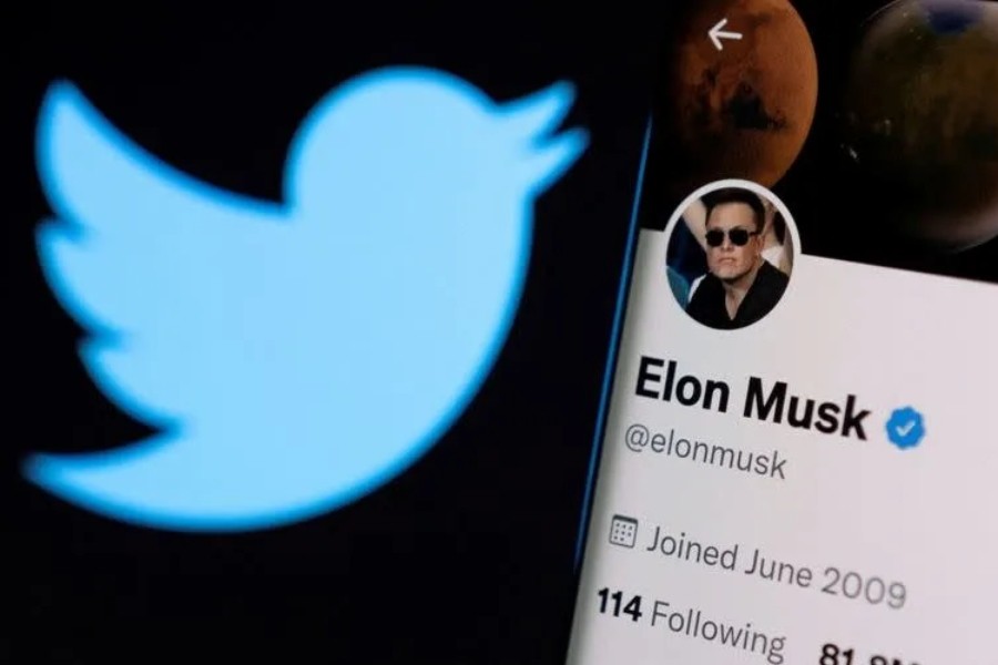 A photo illustration shows Elon Musk's twitter account and the Twitter logo - Reuters