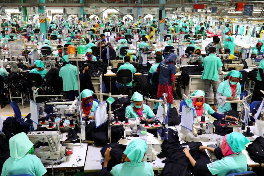 Employees work at at a garments factory in Gazipur, Bangladesh, February 7, 2021. Picture taken February 7, 2021. REUTERS/Mohammad Ponir Hossain/File Photo