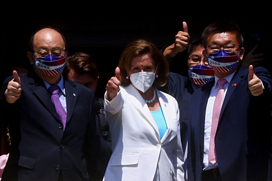 US House of Representatives Speaker Nancy Pelosi gestures next to Legislative Yuan Vice President Tsai Chi-chang as she leaves the parliament in Taipei, Taiwan August 3, 2022. REUTERS/Ann Wang