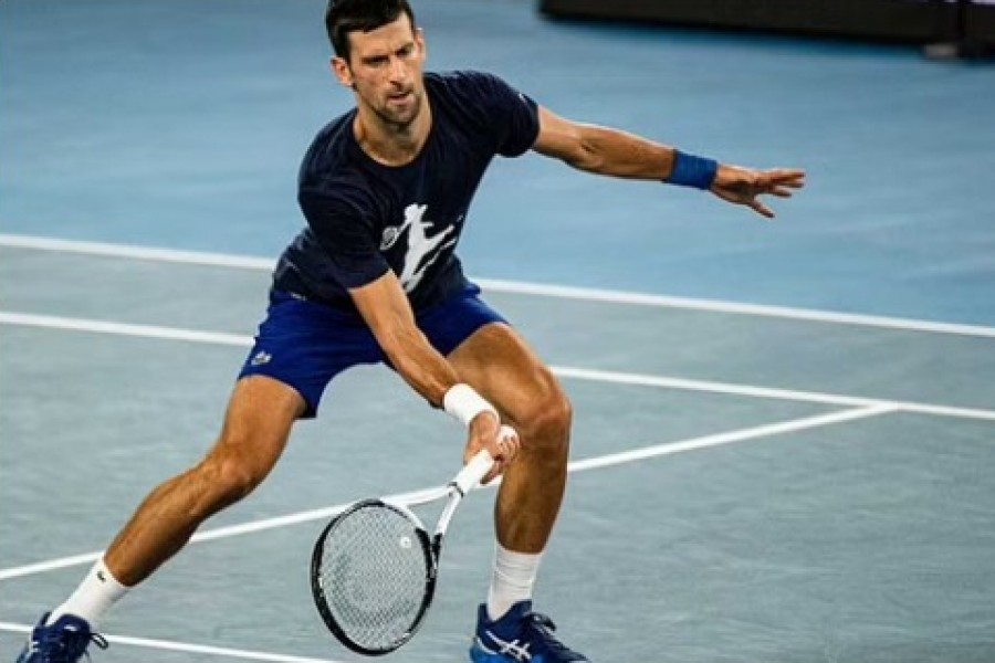 Serbian tennis player Novak Djokovic practices at Melbourne Park as questions remain over the legal battle regarding his visa to play in the Australian Open in Melbourne, Australia, Jan 14, 2022. Diego Fedele via REUTERS