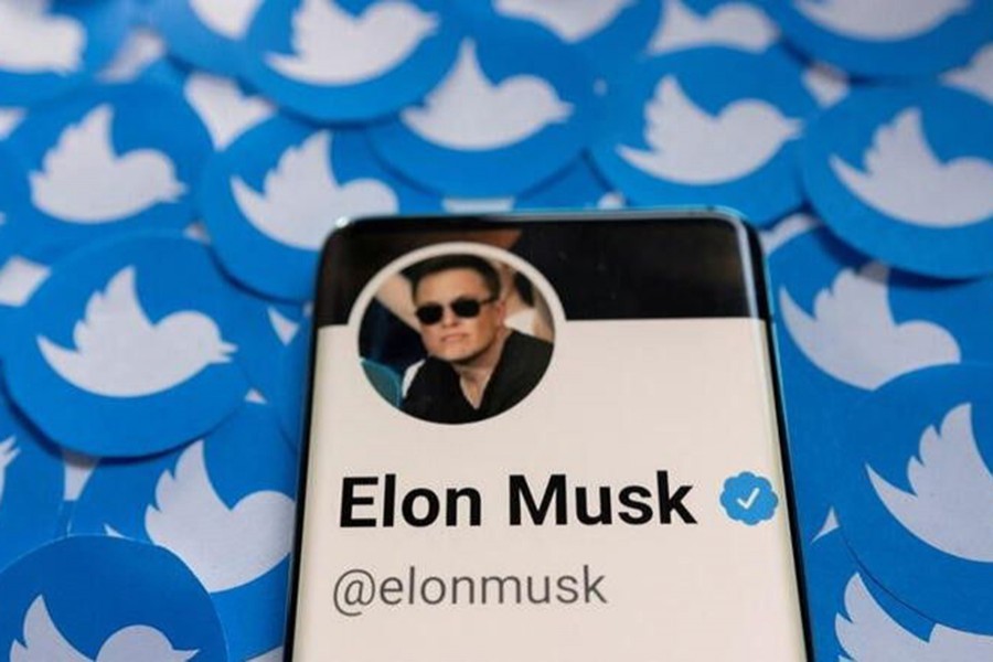 Elon Musk's Twitter profile is seen on a smartphone placed on printed Twitter logos in this picture illustration taken on April 28, 2022 — Reuters/Files