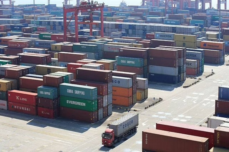 Containers are seen at the Yangshan Deep Water Port, part of the Shanghai Free Trade Zone, in Shanghai, China February 13, 2017. REUTERS