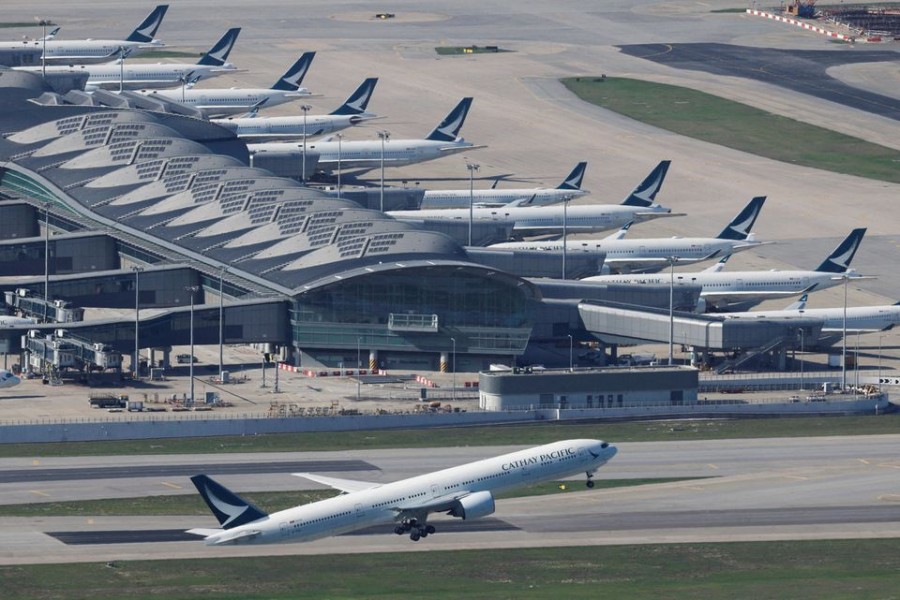 A Cathay Pacific aircraft takes off at the airport, during the coronavirus disease (COVID-19) pandemic, in Hong Kong, China, March 31, 2022. REUTERS/Tyrone Siu