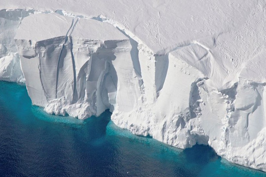 An aerial view of the 200-foot-tall (60-meter-tall) front of the Getz Ice Shelf with cracks, in Antarctica, in this undated handout image — NASA/Handout via REUTERS