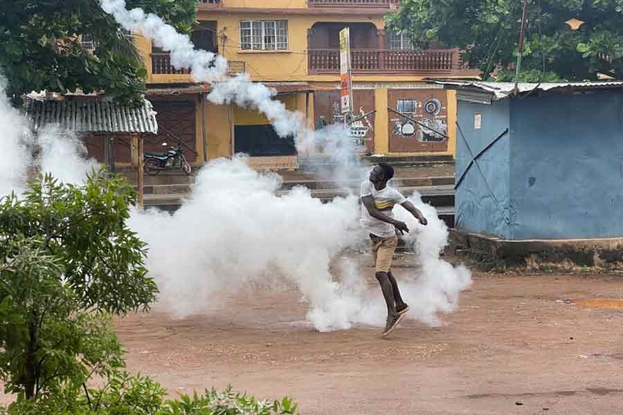 A demonstrator throwing a gas canister during an anti-government protest in Sierra Leone on Wednesday –Reuters photo