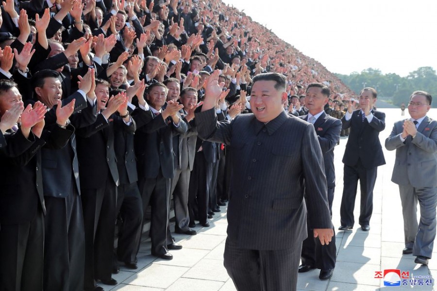 North Korea's leader Kim Jong Un greets health workers and scientists struggling with the coronavirus disease (COVID-19) pandemic during a photo session in Pyongyang, North Korea, in this undated photo released on August 10, 2022 by North Korea's Korean Central News Agency (KCNA). KCNA via REUTERS