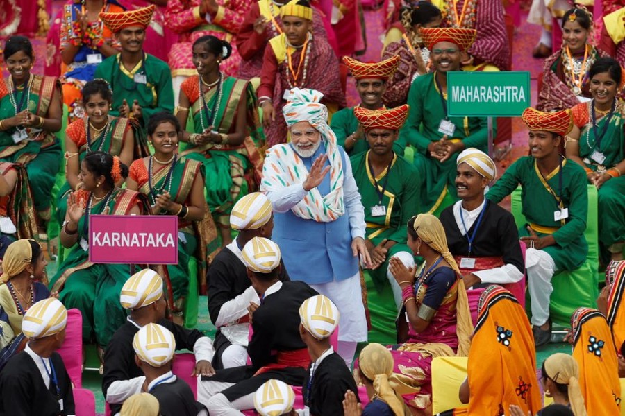 Indian Prime Minister Narendra Modi meets with folk artists after addressing the nation during Independence Day celebrations at the historic Red Fort in Delhi, India, August 15, 2022. REUTERS/Adnan Abidi