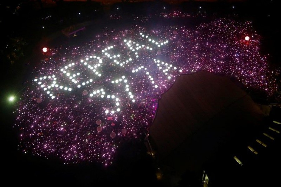 Participants of Pink Dot, an annual event organised in support of the LGBT community, gather in a formation protesting the repeal of Section 377A of Singapore's Penal Code, at the Speakers' Corner in Hong Lim Park in Singapore, June 29, 2019. REUTERS/Feline Lim/File Photo