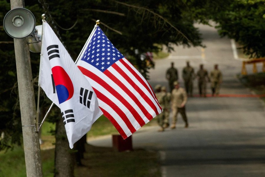 The South Korean and American flags fly next to each other at Yongin, South Korea, August 23, 2016. Picture taken on August 23, 2016. Courtesy Ken Scar/US Army/Handout via REUTERS/File Photo