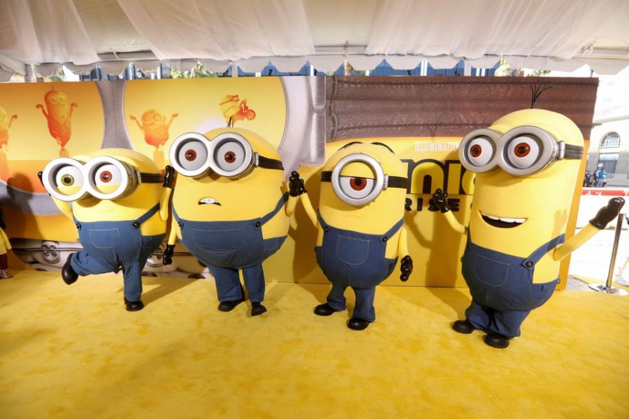 People dressed as the characters Bob, Otto, Stuart and Kevin pose on the red carpet for "Minions: The Rise of Gru" at the TCL Chinese Theatre in Los Angeles, California, U.S., June 25, 2022. REUTERS/David Swanson