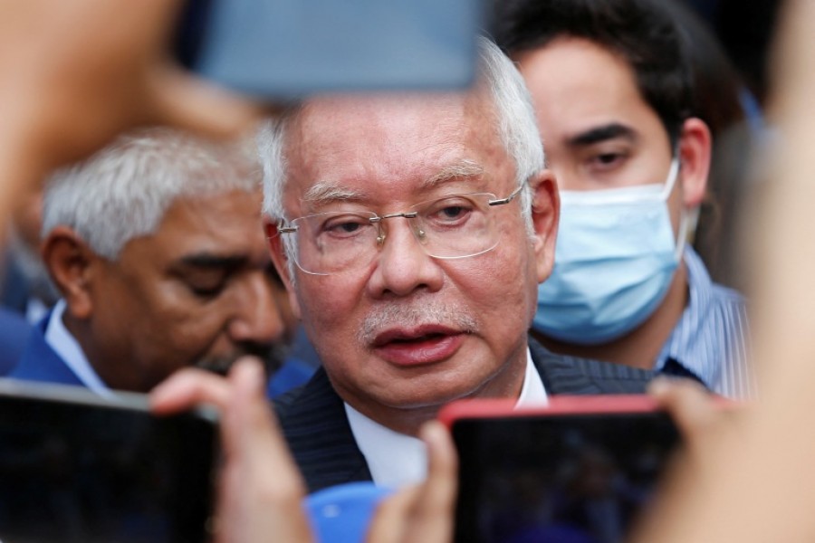 Former Malaysian Prime Minister Najib Razak speaks to journalists outside the Federal Court during a court break, in Putrajaya, Malaysia August 23, 2022. REUTERS/Lai Seng Sin