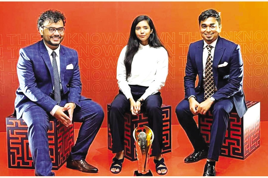 Team Drogo from IBA, University of Dhaka, with the champion trophy; (from left to right) Sadid Jubayer Murshed, Tasmim Sultana Nawmi, and Syed Shadab Tajwar