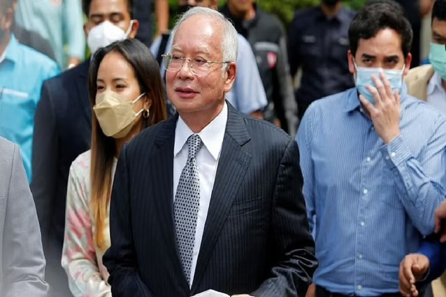 Former Malaysian Prime Minister Najib Razak walks out from the Federal Court during a court break, in Putrajaya, Malaysia Aug 23, 2022. REUTERS