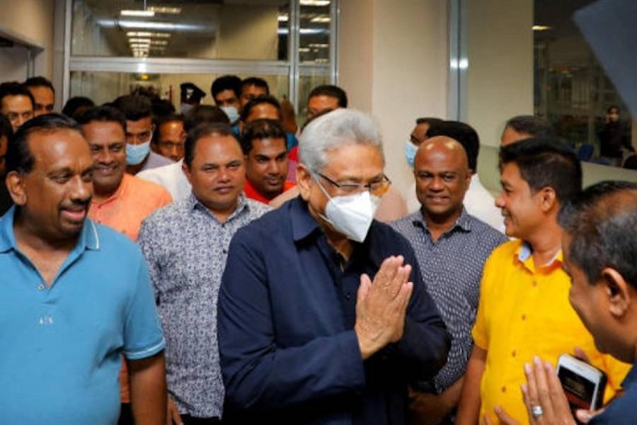 Supporters welcome ousted former president Gotabaya Rajapaksa back to Sri Lanka at Bandaranaike International Airport in Colombo early Saturday. (Reuters) 