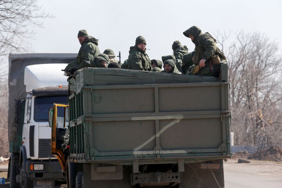 Service members of pro-Russian troops are seen in the body of a truck during Ukraine-Russia conflict on a road near the besieged southern port city of Mariupol, Ukraine on March 21, 2022 — Reuters/Files