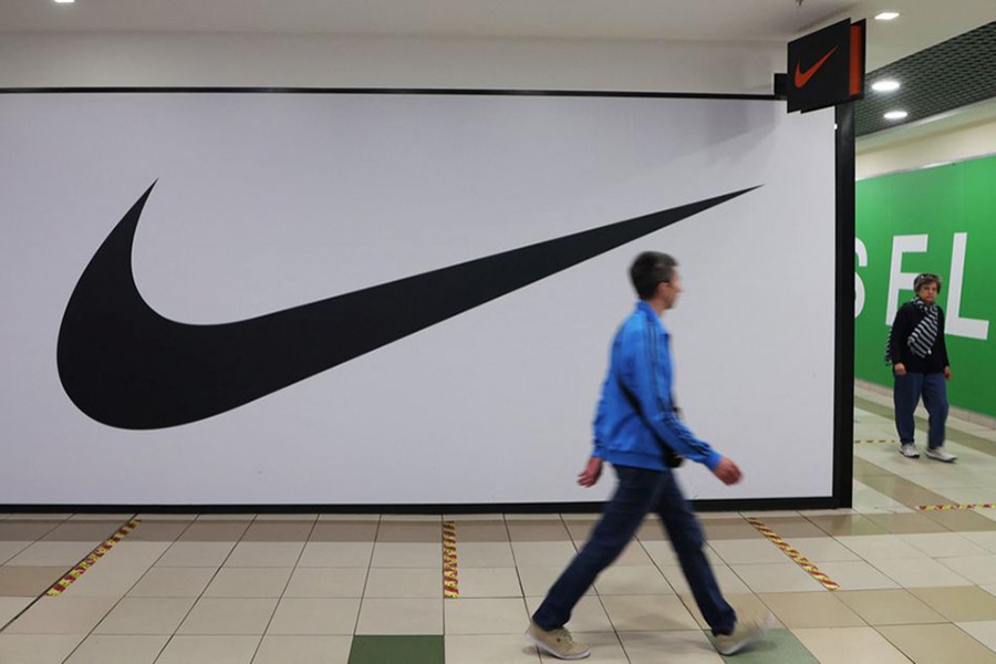 People walk past a closed store of the sporting goods retailer Nike at a shopping mall in Saint Petersburg on Russia May 25, 2022 — Reuters/Files