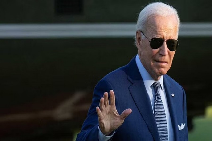 US President Joe Biden walks from Marine One to the White House following a trip from Michigan, in Washington, US, September 14, 2022. REUTERS/Tom Brenner