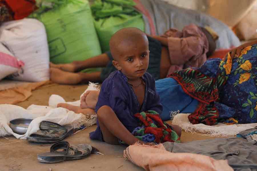 A displaced boy sitting at a refugee camp, following rains and floods during the monsoon season in Sehwan of Pakistan on September 16 this year –Reuters file photo