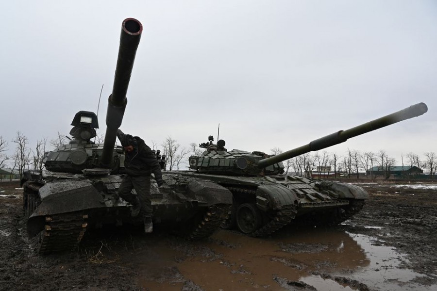 A Russian service member jumps off a T-72B3 main battle tank during drills held by the armed forces of the Southern Military District at the Kadamovsky range in the Rostov region, Russia February 3, 2022. REUTERS/Sergey Pivovarov/File Photo