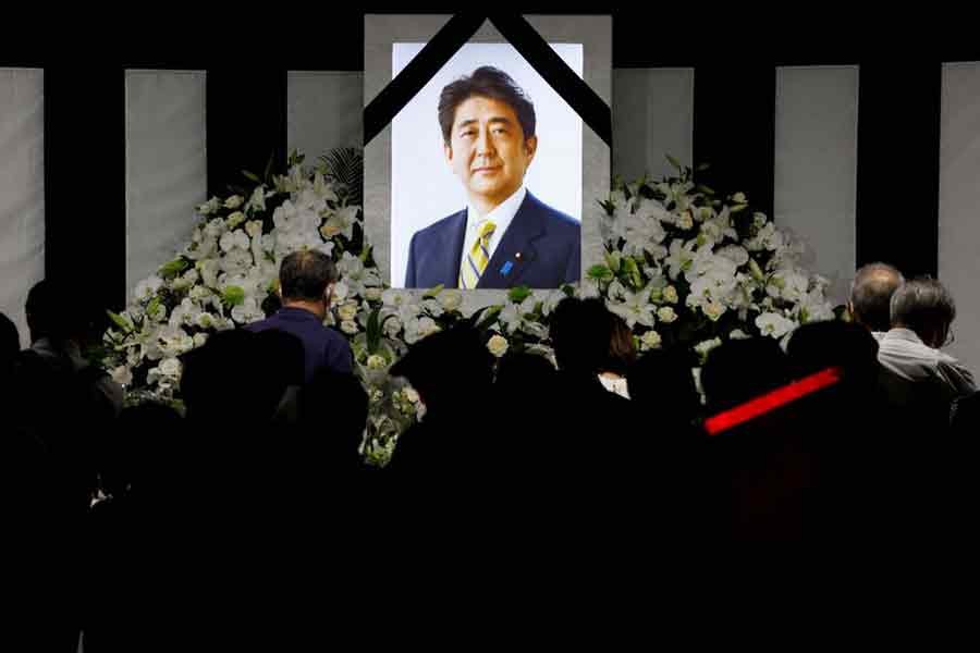 People lay flowers and pay their respects outside Nippon Budokan Hall where the state funeral for former Prime Minister Shinzo Abe was held in Tokyo on Wednesday –Reuters photo