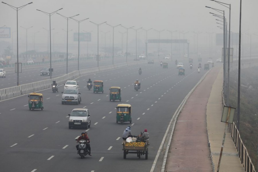 Vehicles are seen on a highway on a smoggy morning in New Delhi, India, December 2, 2021. REUTERS/Anushree Fadnavis